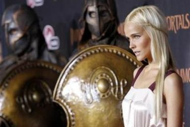 Cast member Isabel Lucas poses at the world premiere of &quot;Immortals&quot; at the Nokia theatre in Los Angeles November 7, 2011.