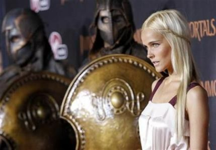 Cast member Isabel Lucas poses at the world premiere of &quot;Immortals&quot; at the Nokia theatre in Los Angeles November 7, 2011.