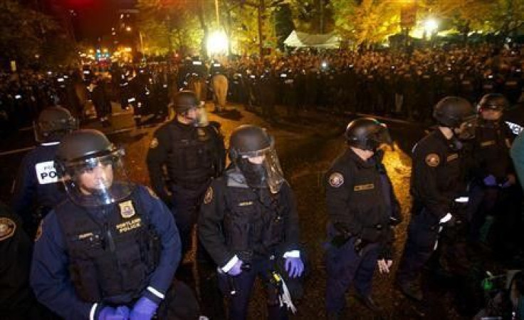 Police clear Occupy Wall Street protesters in Portland, Oregon early November 13, 2011.
