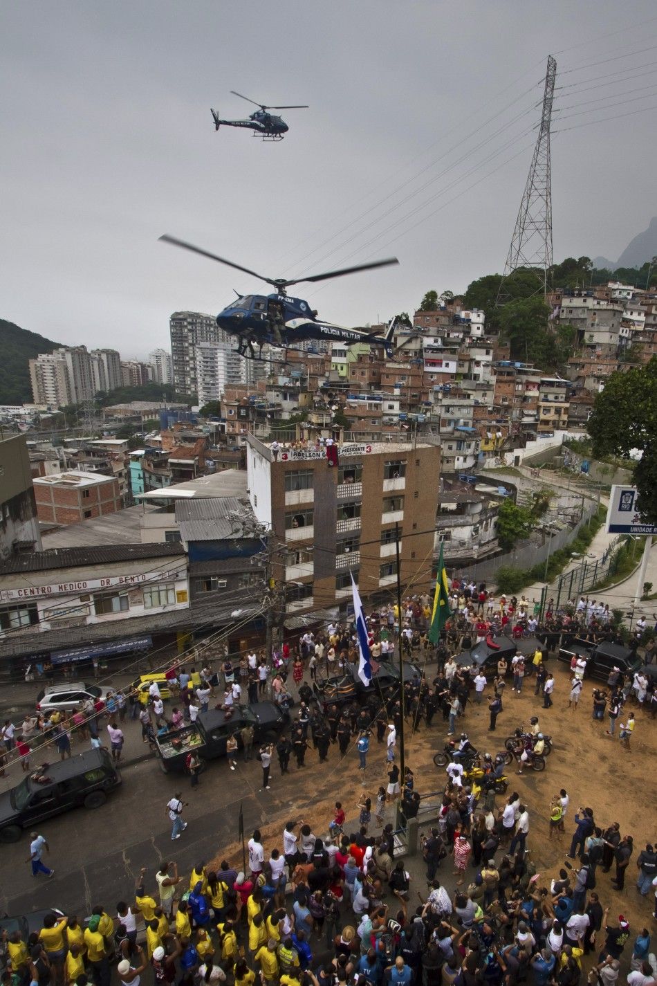 Police helicopters fly over Rocinha slum during the quotShock of Peacequot operation to install a Peacekeeping Unit UPP in Rio de Janeiro November 13, 2011.