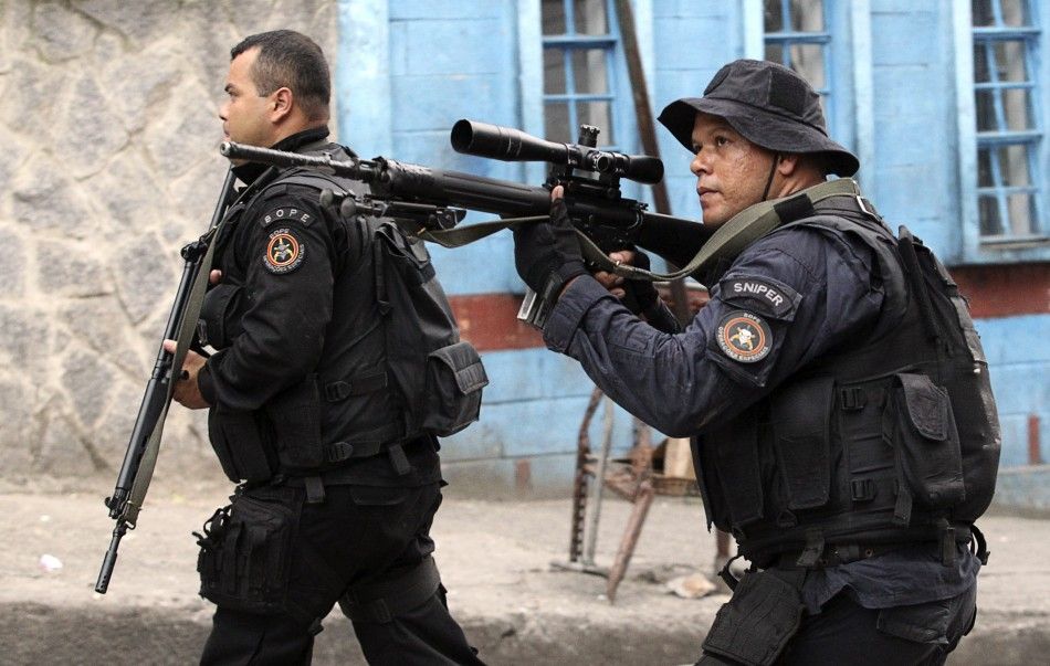 Policemen patrol the Rocinha slum during the quotShock of Peacequot operation to install Peacekeeping Unit UPP in Rio de Janeiro November 13, 2011