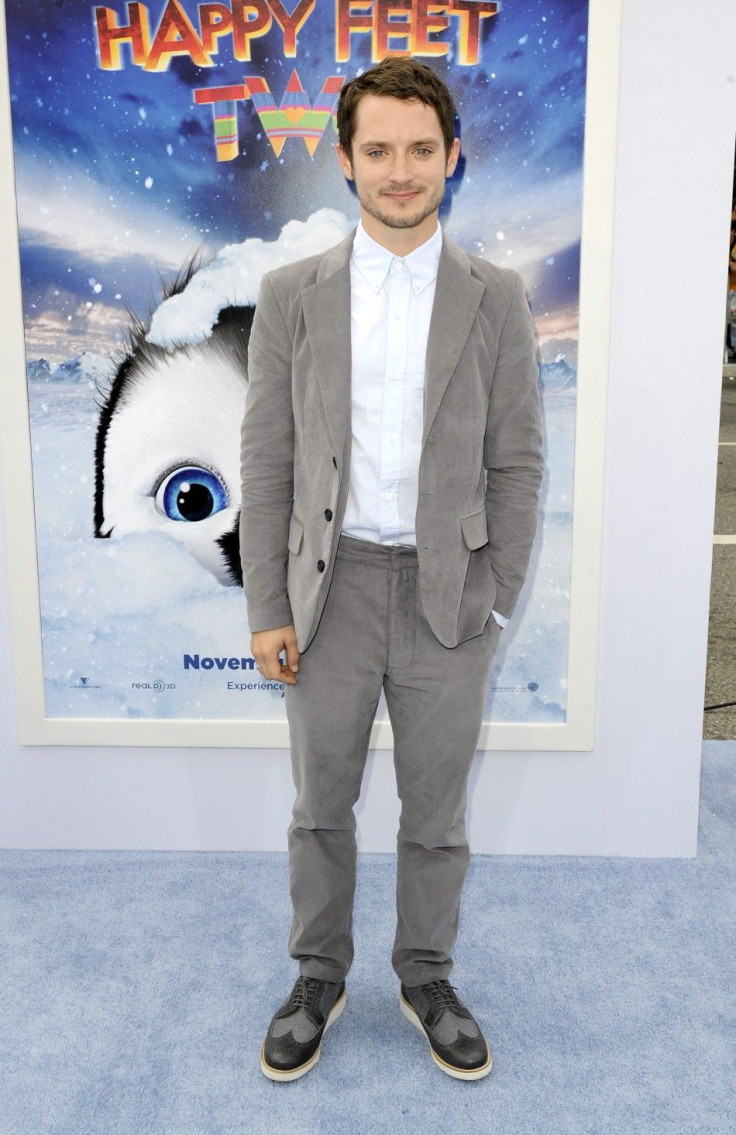 Actor and voice of Mumble, Elijah Wood, arrives at the premiere of "Happy Feet Two" in the Hollywood area of Los Angeles, California
