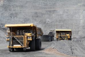 Trucks haul ore at Barrick Gold project