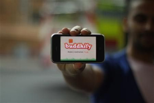 Rohan Gunatillake displays his new Buddhify app, in an undated photo.