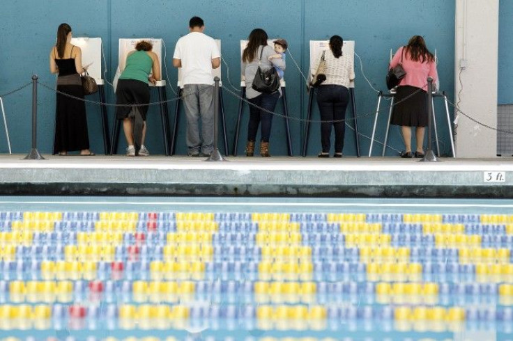Voters cast their votes at the Echo Park Deep Pool being used as polling place in Los Angeles 