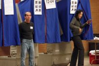  A voter exits a voting booth after casting her ballot in Wilmington