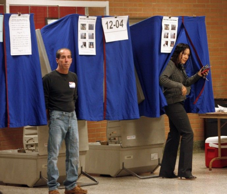  A voter exits a voting booth after casting her ballot in Wilmington