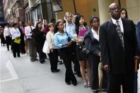 People wait in line to enter a job fair in New York August 15, 2011.