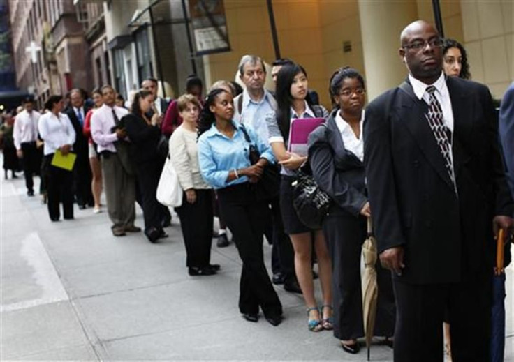 People wait in line to enter a job fair in New York August 15, 2011.