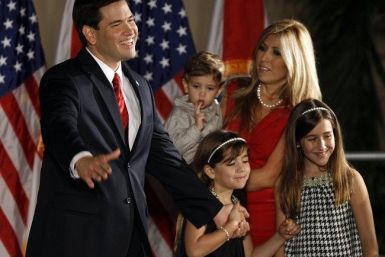 U.S. Republican Senate candidate Marco Rubio (L) and his wife Jeanette with children Dominic (L), Daniella and Amanda (R) attend outdoor victory celebrations at the Biltmore Hotel in Coral Gables, Florida November 2, 2010. 