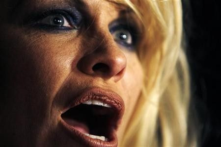Actress Pamela Anderson is seen backstage before the start of British designer Vivienne Westwood's Fall/Winter 2009/10 women's ready-to-wear fashion collection during Paris Fashion Week