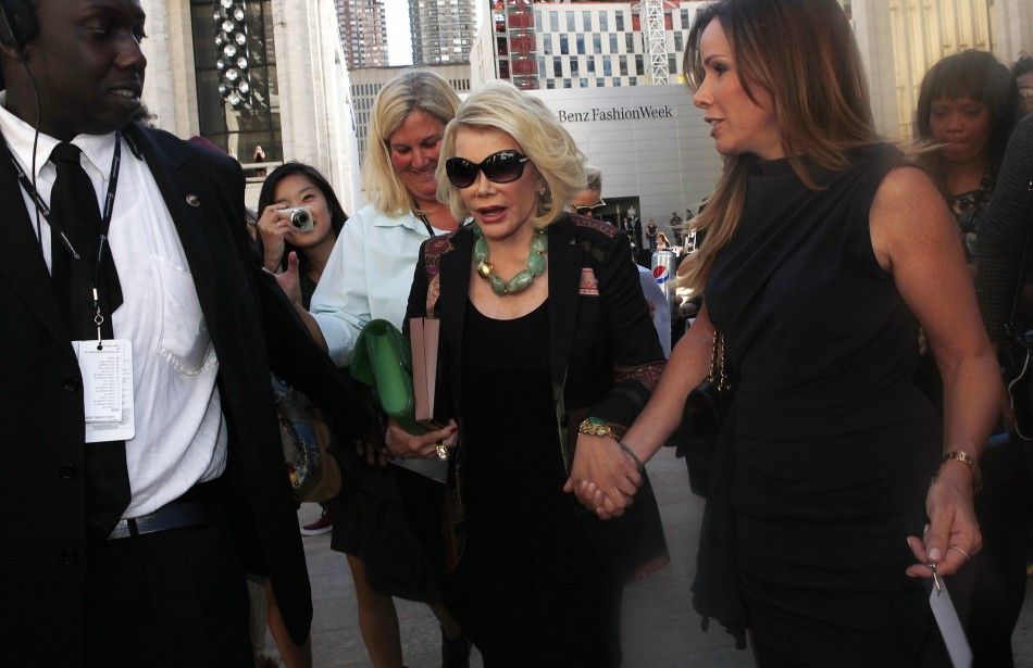 Joan Rivers and her daughter Melissa leave Avery Fisher Hall after the Chris Benz show at Mercedes-Benz Fashion Week in new York, Sept. 10, 2012.