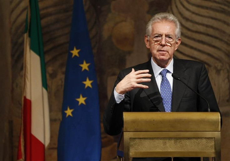 Newly appointed Prime Minister Mario Monti gestures during a news conference at Giustiniani Palace in Rome