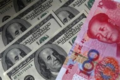 A 100 yuan banknote is placed next to $100 banknotes