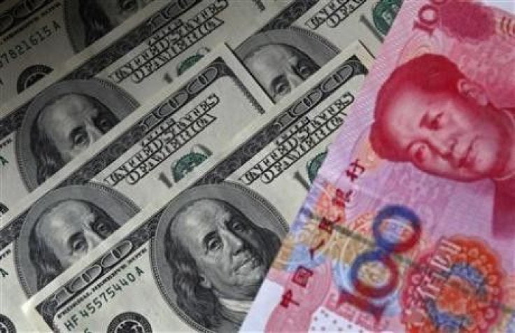 A 100 yuan banknote is placed next to $100 banknotes