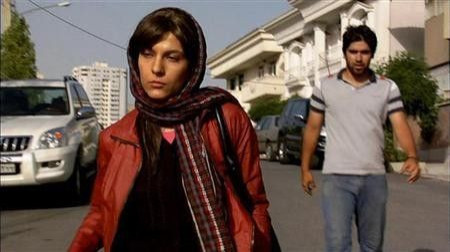Actors Ahmad Akbarzadeh and Tahereh Esfahani are shown in a scene from the film ''Dog Sweat'' in this undated publicity photograph obtained on November 16, 2011.
