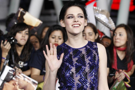 Cast member Kristen Stewart poses at the premiere of &quot;The Twilight Saga: Breaking Dawn - Part 1&quot; at Nokia Theatre in Los Angeles