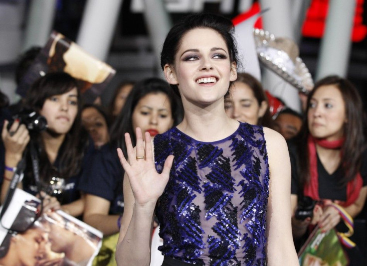 Cast member Kristen Stewart poses at the premiere of &quot;The Twilight Saga: Breaking Dawn - Part 1&quot; at Nokia Theatre in Los Angeles