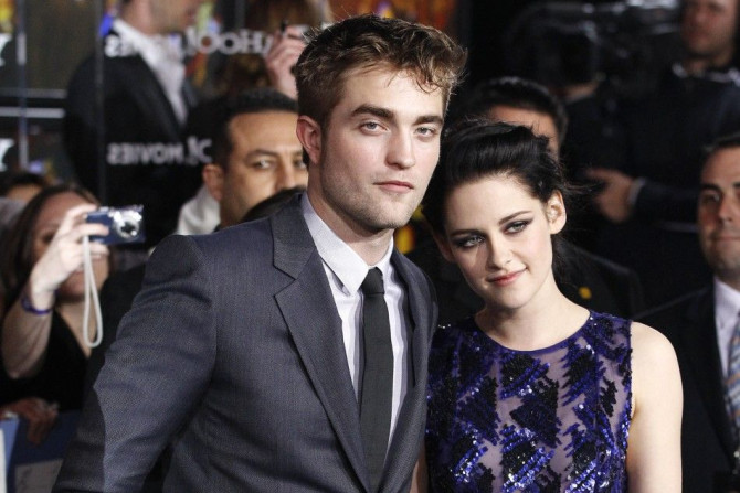 Cast members Robert Pattinson and Kristen Stewart pose at the premiere of &quot;The Twilight Saga: Breaking Dawn - Part 1&quot; at Nokia Theatre in Los Angeles 