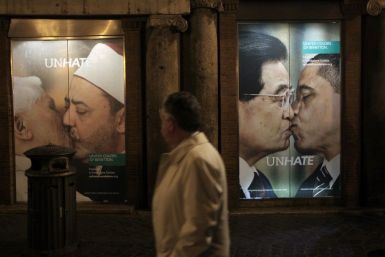 A man strolls in front of the Benetton store in downtown Rome November 16, 2011. Benetton withdrew an advertisement using an image of Pope Benedict kissing an imam on the mouth after the Vatican protested on Wednesday at the Italian clothing firm&#039;s l