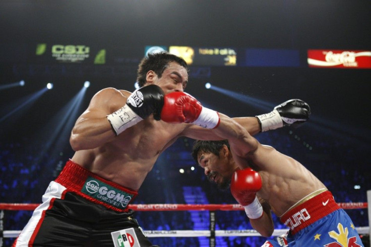Marquez of Mexico battles it out with Pacquiao of the Philippines during their WBO welterweight fight at the MGM Grand Garden Arena in Las Vegas