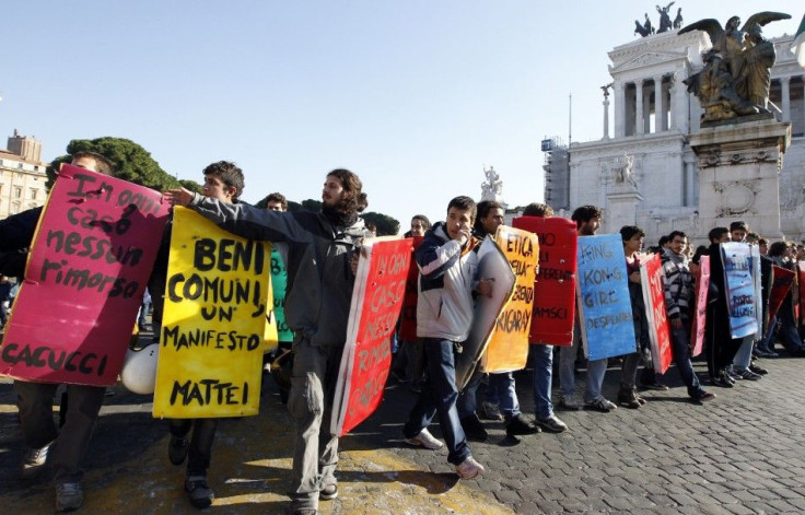 Students holding signs protest in downtown Rome