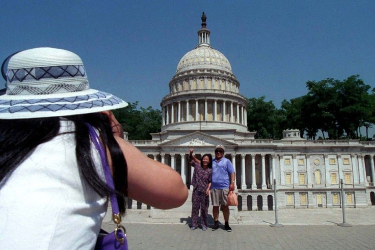 Chinese Tourists Take Photos in front of Capital Building Replica in Beijing