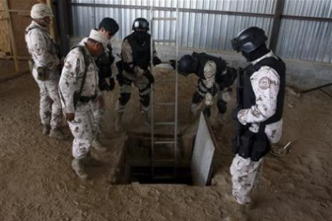 Soldier prepare a ladder to enter a tunnel during a presentation to the media in Tijuana November 16, 2011.