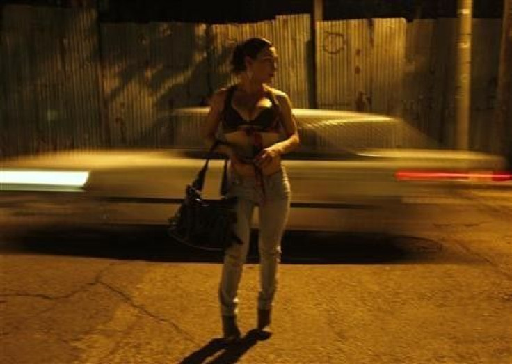 A transgender prostitute waits for clients on a street in Tegucigalpa March 10, 2011.