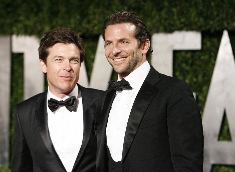Actors Jason Bateman and Bradley Cooper arrive at the 2010 Vanity Fair Oscar party in West Hollywood