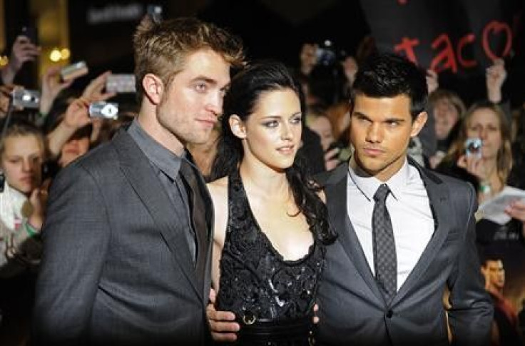 Actors Robert Pattinson (L), Kristen Stewart (C) and Taylor Lautner arrive for the British premiere of &#039;The Twilight Saga: Breaking Dawn&#039; at Westfield in east London