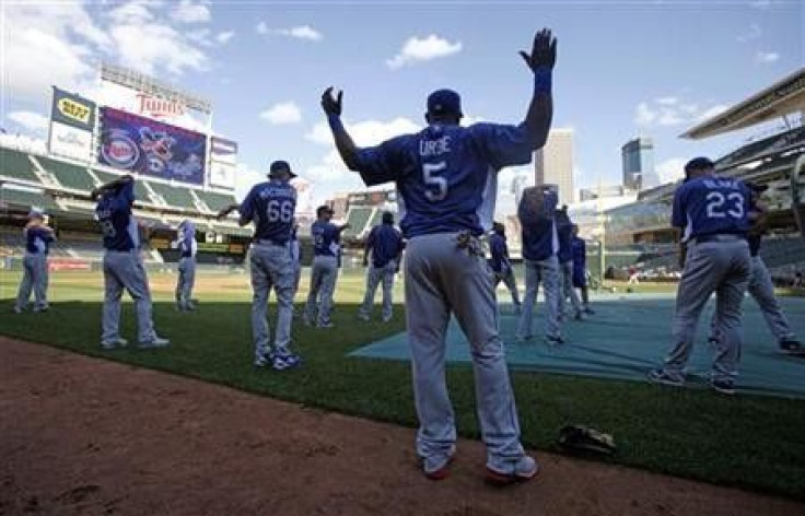Los Angeles Dodgers second baseman Juan Uribe warms up with his teammates before taking batting practice before the start of their American League MLB interleague baseball game at Target Field in Minneapolis