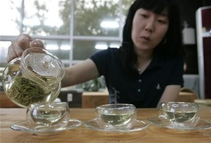 A woman pours hot water to make green tea at a traditional tea house in Boseong, about 397 km (246 miles) south of Seoul