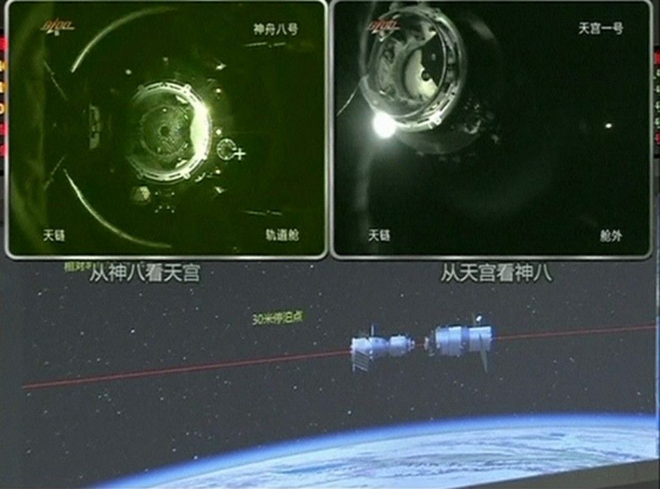 A view of China039s Tiangong 1 module just before it docks with the Shenzhou-8 spacecraft on a monitoring screen at the Beijing Aerospace Flight Control Center.