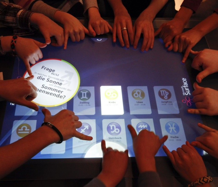 Students at Berlin's Hausburg European school use a Microsoft Surface in a digital classroom in Hanover.
