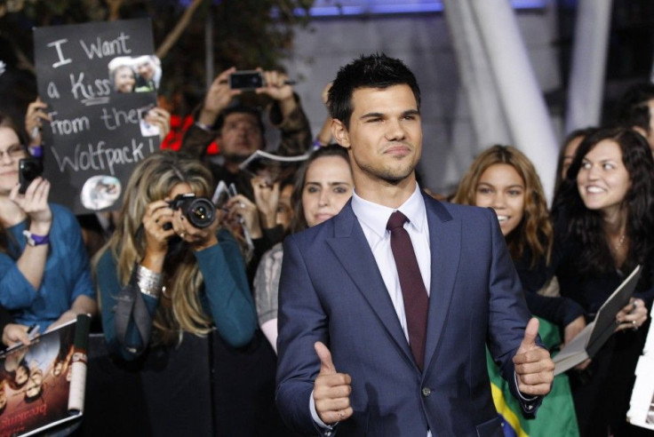 Lautner gestures at the premiere of &quot;The Twilight Saga: Breaking Dawn - Part 1&quot; in Los Angeles
