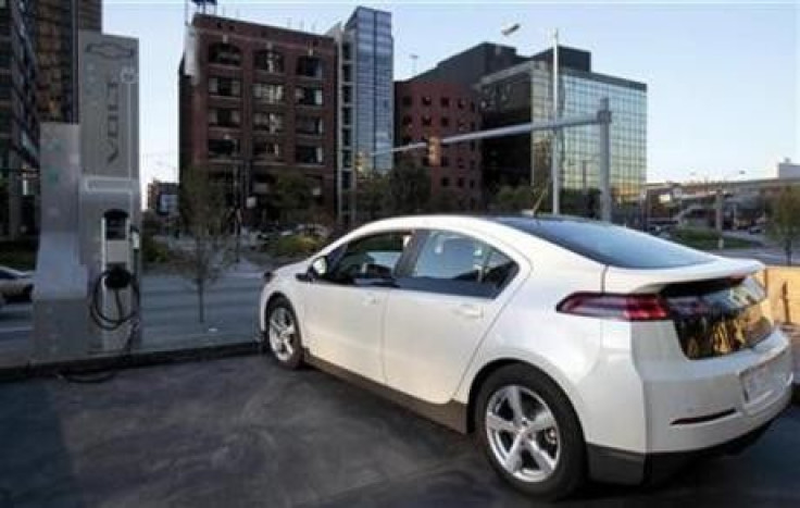A Chevrolet Volt sits next to a newly installed electric vehicle charging station outside General Motor Co world headquarters in Detroit, Michigan October 12, 2010. 