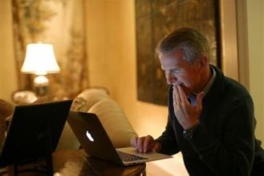 Hewlett Packard executive chairman and Kleiner Perkins managing partner Ray Lane works on his computer at his home in Atherton, California November 11, 2011.