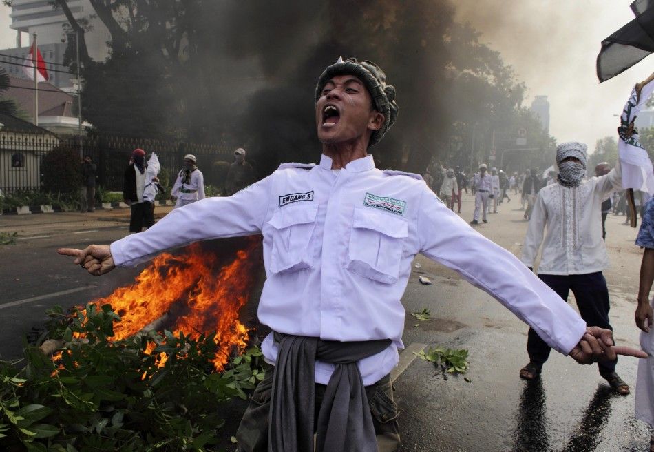 Muslim protesters in Jakarta, Indonesia faced off with police officers during an anti-U.S. protest there Monday.