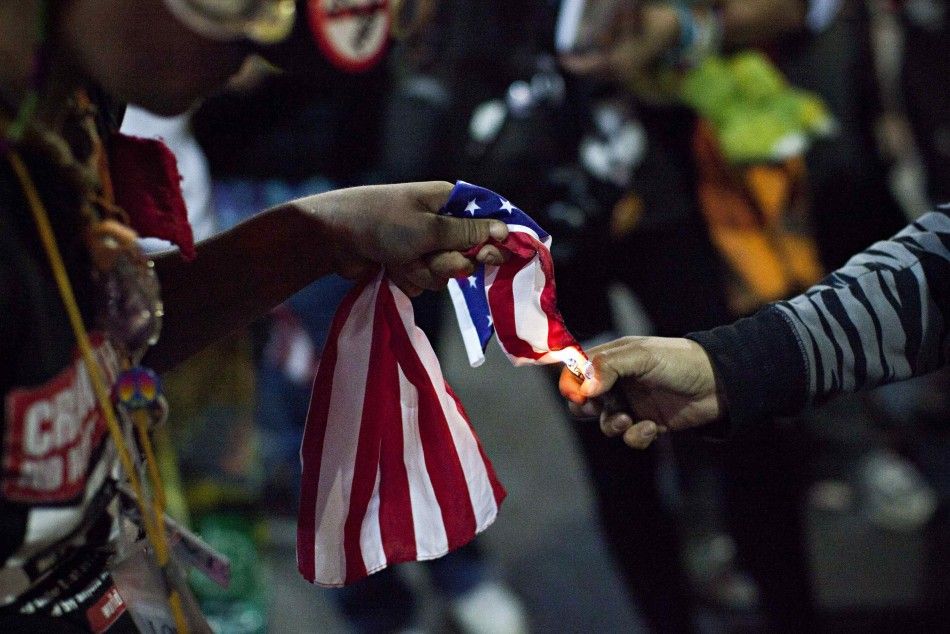 An Occupy Wall Street demonstrator burned an American flag during a protest Sunday.