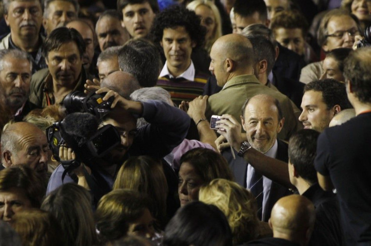 Prime ministerial candidate Perez Rubalcaba of the Spanish Socialist Workers&#039; Party poses with a supporter in Fuenlabrada