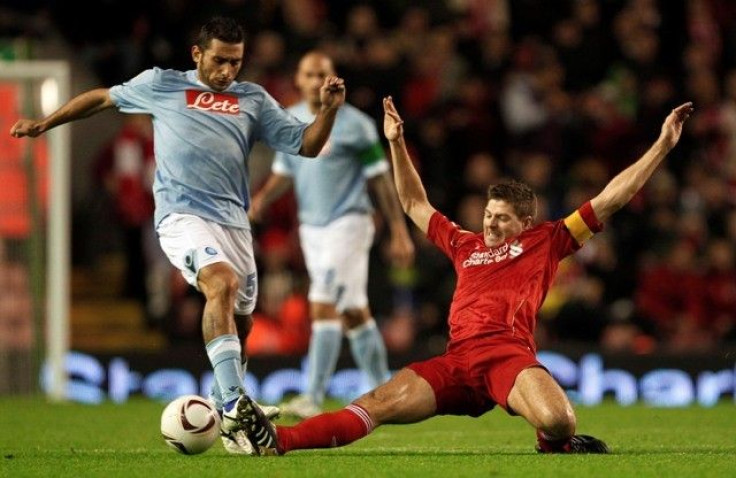 Liverpool's Steven Gerrard challenges Napoli's Micele Pazienza during their Europa League soccer match at Anfield in Liverpool.