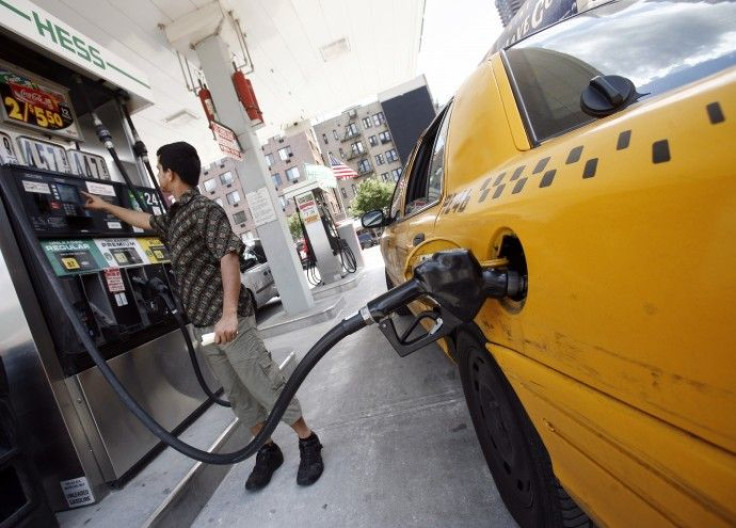 New York City cab driver fills his taxi up with gas at Hess station in New York