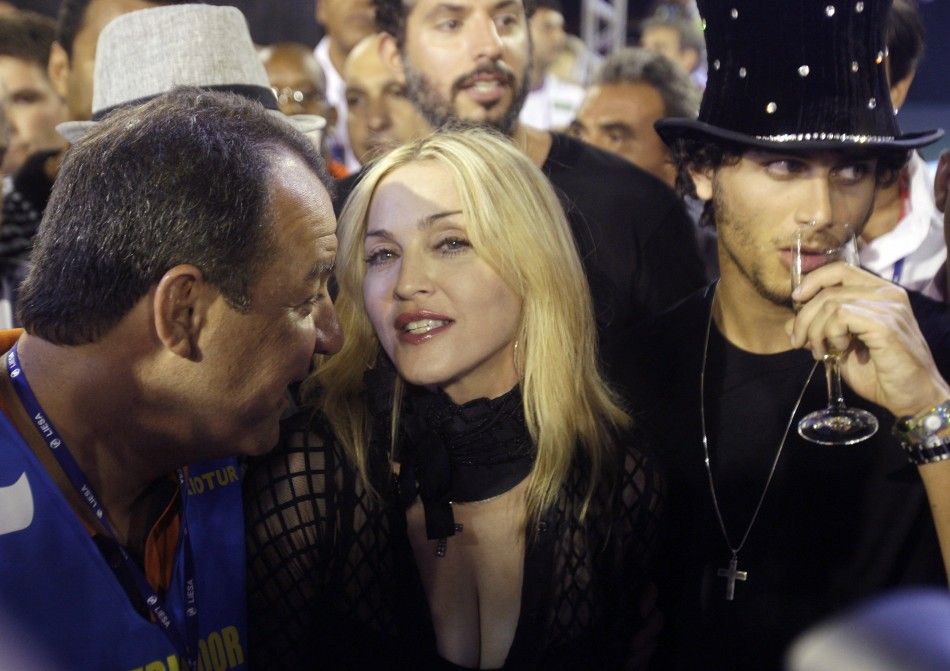 U.S. singer Madonna, boyfriend Jesus Luz and Rio Governor Sergio Cabral watch Carnival in Rio