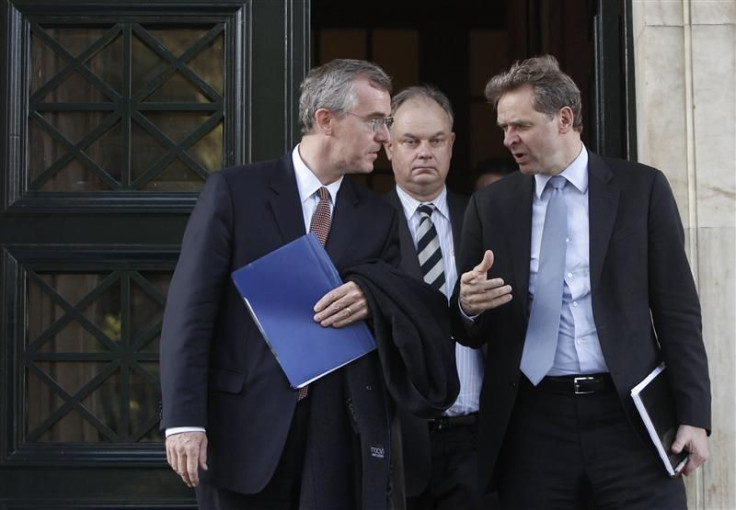 IMF's chief of mission Thomsen and IMF's senior representative for Greece Traa leave the parliament building in Athens