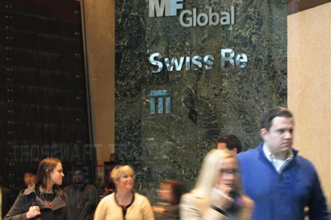 People walk through the office complex where MF Global Holdings Ltd have an office on 52nd Street in midtown Manhattan New York