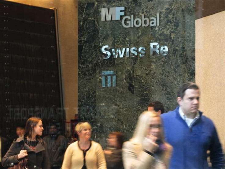 People walk through the office complex where MF Global Holdings Ltd have an office on 52nd Street in midtown Manhattan New York