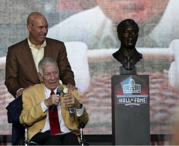 Steve Sabol (standing) and Ed Sabol (sitting)