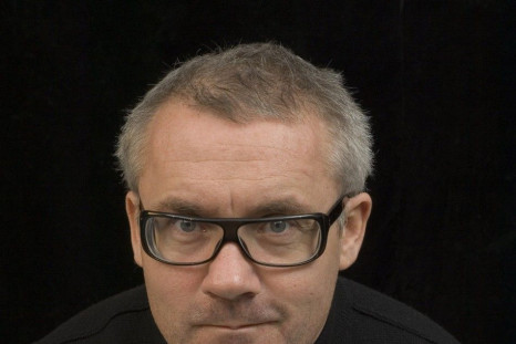 British artist Damien Hirst poses with &#039;For the love of God&#039;.