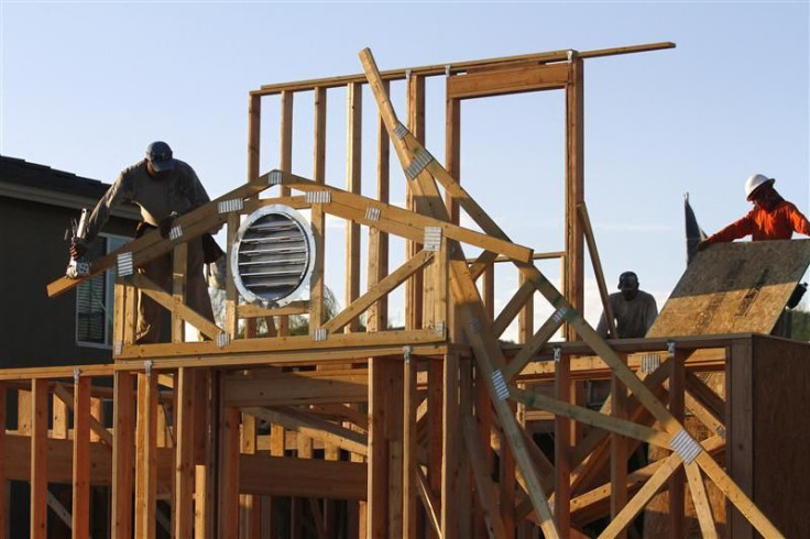 Workers construct the roof of a house in Phoenix